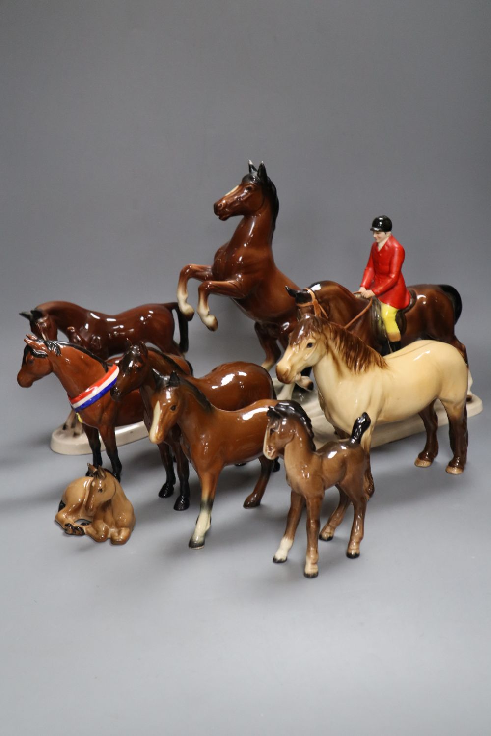 A collection of four various Beswick model horses including Highland, Another Bunch and Another Star, and three Continental horse model